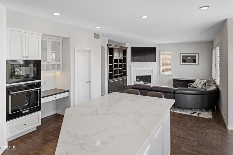 Fireplace, Interior, Kitchen, Living room, Recessed Lighting, Stainless Steel Appliances, Wood Texture Flooring