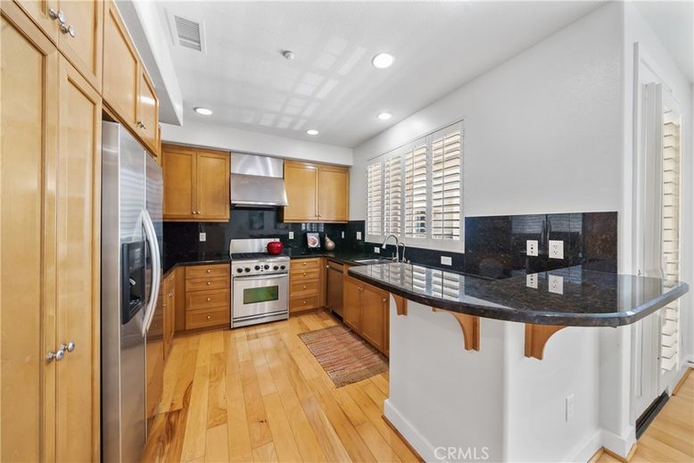 Interior, Kitchen, Recessed Lighting, Stainless Steel Appliances, Washer, Wood Texture Flooring