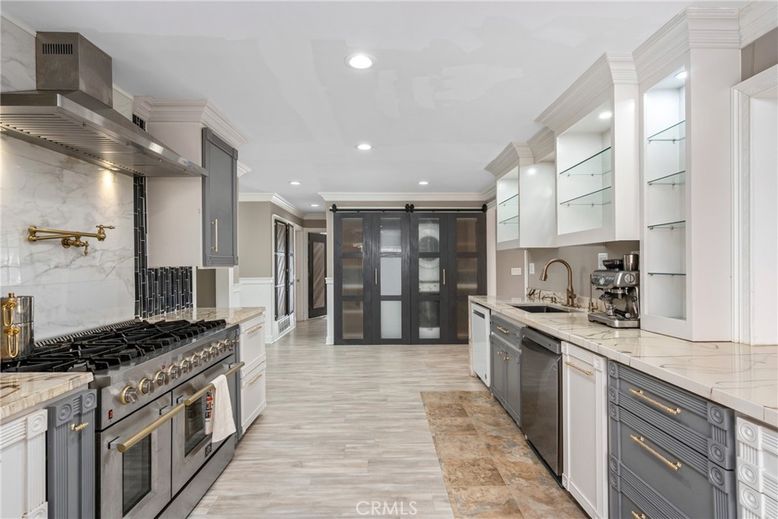 Interior, Kitchen, Marble Walls, Recessed Lighting, Stainless Steel Appliances
