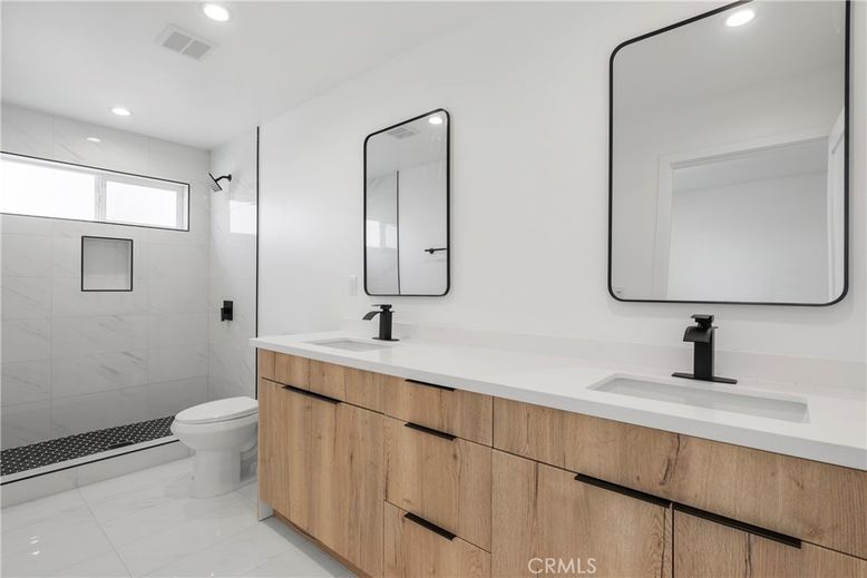 Bathroom, Dual Sink Vanities, Glass Shower, Interior, Marble, Marble Walls, Recessed Lighting