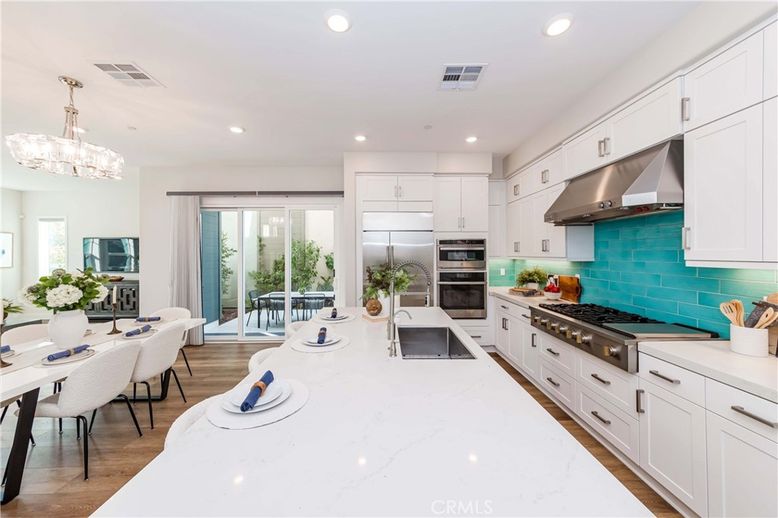 Chandelier, Dining room, Interior, Kitchen, Recessed Lighting, Stainless Steel Appliances, Wood Texture Flooring
