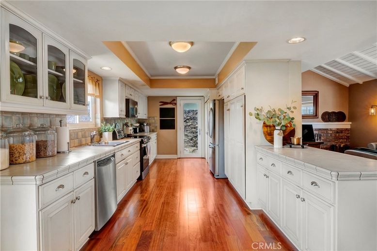 Interior, Kitchen, Recessed Lighting, Stainless Steel Appliances, Tile Countertops, Wood Texture Flooring