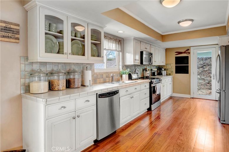 Interior, Kitchen, Recessed Lighting, Stainless Steel Appliances, Tile Countertops, Wood Texture Flooring