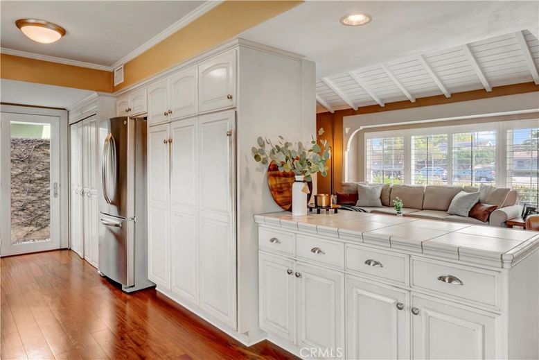 Interior, Kitchen, Recessed Lighting, Tile Countertops, Wood Texture Flooring