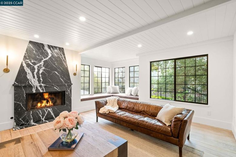 Fireplace, Interior, Living room, Marble Walls, Recessed Lighting, Wood Texture Flooring