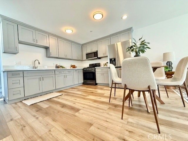 Dining room, Interior, Kitchen, Recessed Lighting, Stainless Steel Appliances, Wood Texture Flooring