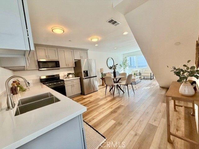 Dining room, Interior, Kitchen, Recessed Lighting, Stainless Steel Appliances, Water, Wood Texture Flooring