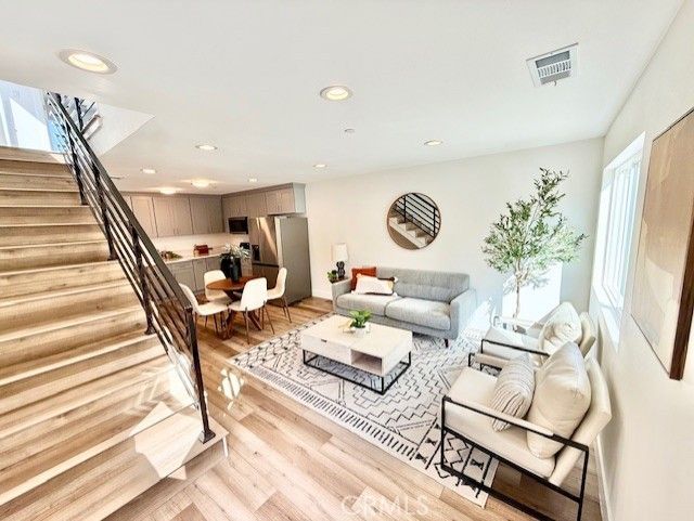 Dining room, Interior, Kitchen, Living room, Recessed Lighting, Stainless Steel Appliances, Wood Texture Flooring