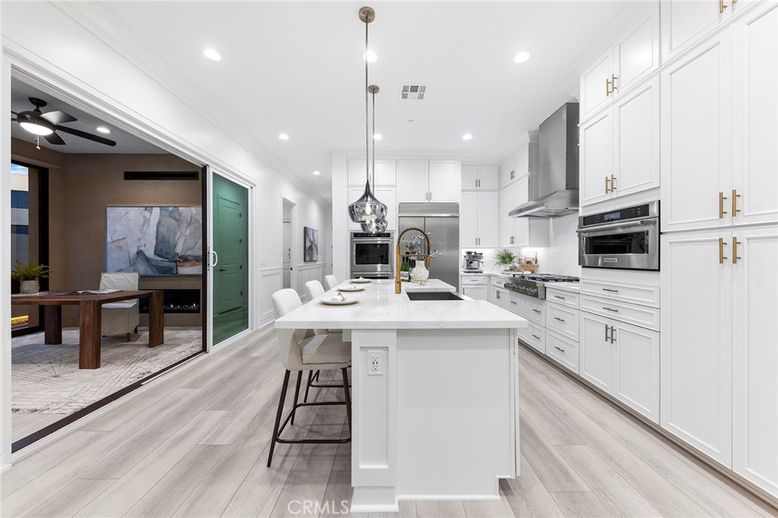 Dining room, Interior, Kitchen, Pendant Lights, Recessed Lighting, Stainless Steel Appliances, Wood Texture Flooring