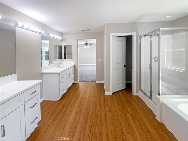 Bathroom, Dual Sink Vanities, Glass Shower, Interior, Recessed Lighting, Wood Texture Flooring