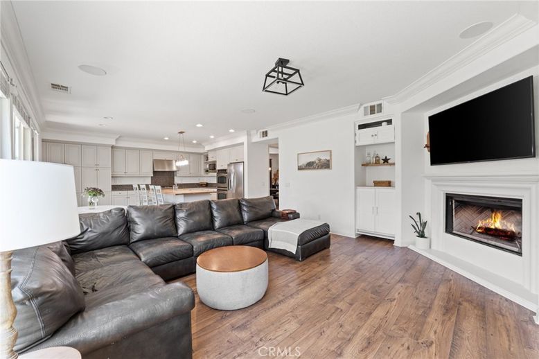 Fireplace, Interior, Kitchen, Living room, Pendant Lights, Recessed Lighting, Stainless Steel Appliances, Wood Texture Flooring
