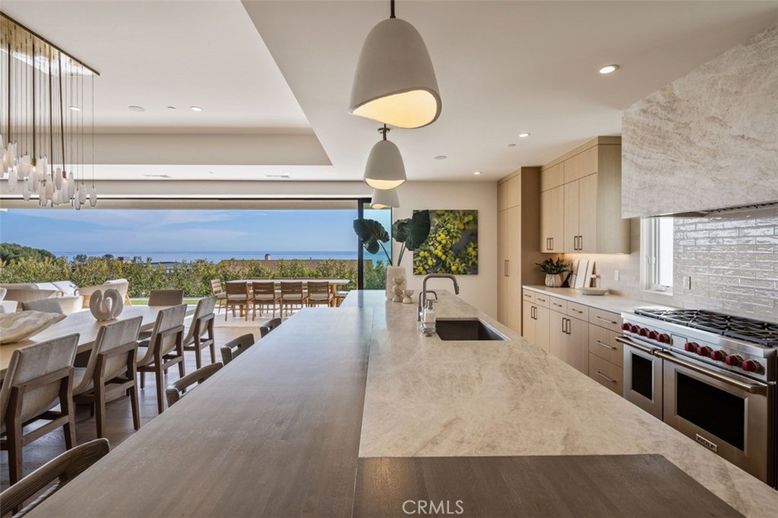 Dining room, Interior, Kitchen, Pendant Lights, Recessed Lighting, Stainless Steel Appliances, Water, Wood Texture Flooring