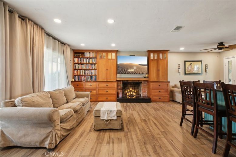 Dining room, Fireplace, Interior, Living room, Recessed Lighting, Wood Texture Flooring