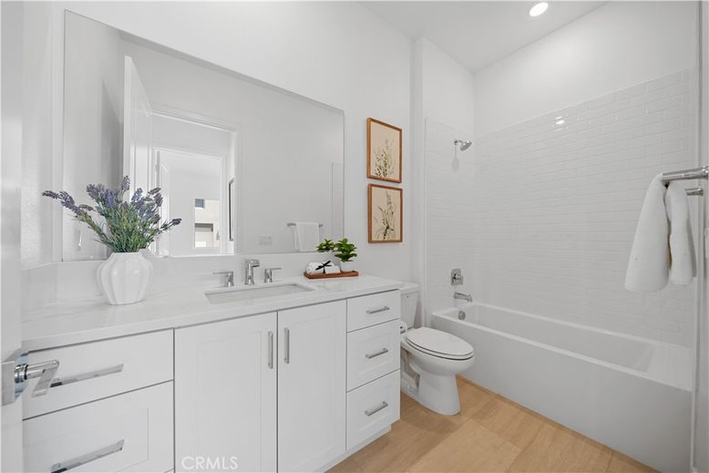 Bathroom, Dual Sink Vanities, Interior, Recessed Lighting, Wood Texture Flooring