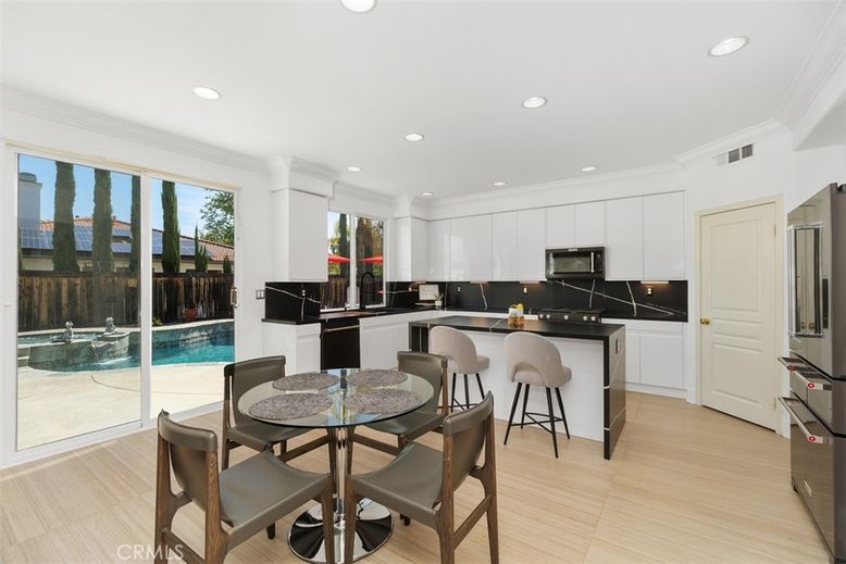 Dining room, Interior, Kitchen, Recessed Lighting, Stainless Steel Appliances, Wood Texture Flooring