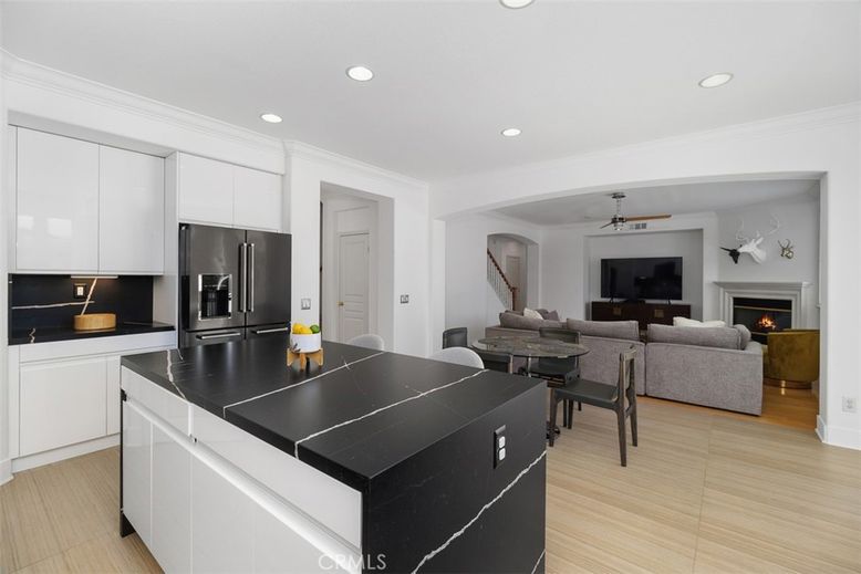 Fireplace, Interior, Kitchen, Living room, Recessed Lighting, Stainless Steel Appliances, Wood Texture Flooring