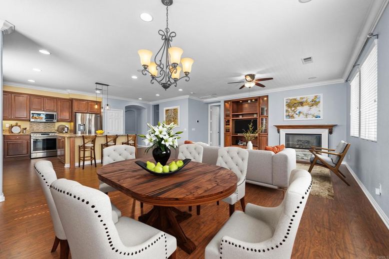 Chandelier, Dining room, Fireplace, Interior, Kitchen, Recessed Lighting, Stainless Steel Appliances, Wood Texture Flooring