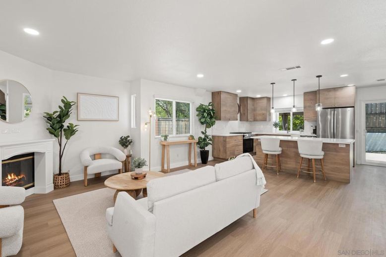 Fireplace, Interior, Kitchen, Living room, Pendant Lights, Recessed Lighting, Stainless Steel Appliances, Wood Texture Flooring
