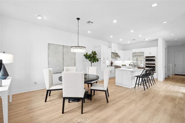 Chandelier, Dining room, Interior, Kitchen, Pendant Lights, Recessed Lighting, Stainless Steel Appliances, Wood Texture Flooring