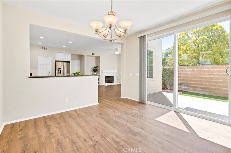 Chandelier, Empty room, Interior, Kitchen, Recessed Lighting, Stainless Steel Appliances, Wood Texture Flooring