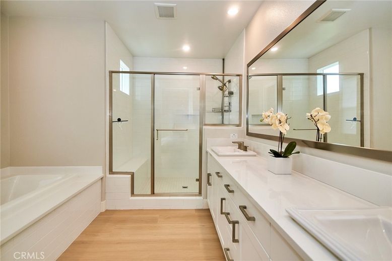 Bathroom, Dual Sink Vanities, Glass Shower, Interior, Recessed Lighting, Wood Texture Flooring