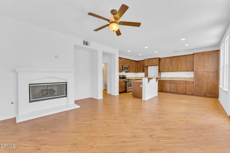 Empty room, Fireplace, Interior, Kitchen, Recessed Lighting, Wood Texture Flooring