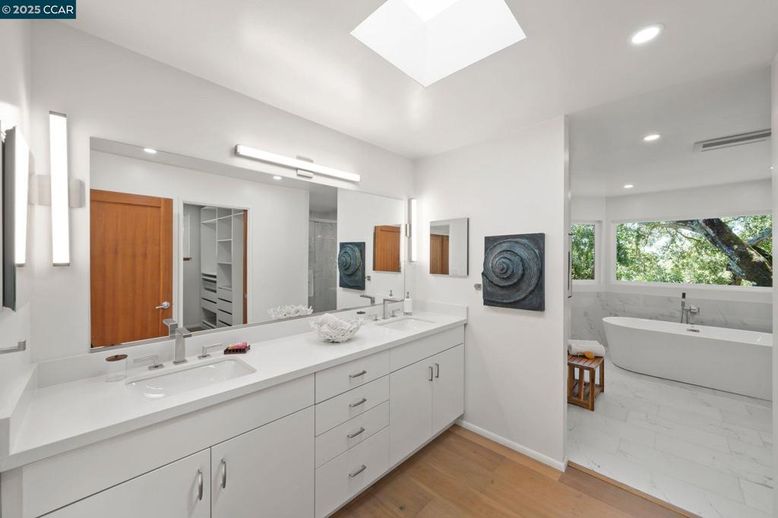 Bathroom, Dual Sink Vanities, Free Standing Baths, Interior, Marble, Recessed Lighting, Wood Texture Flooring