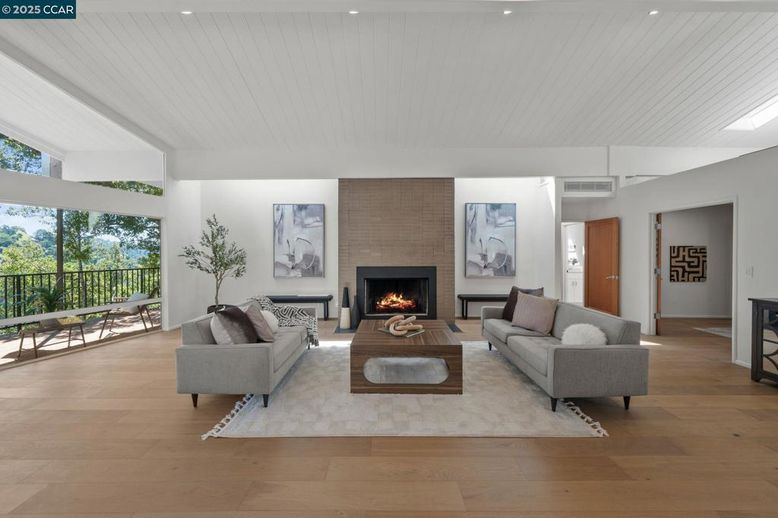 Fireplace, Interior, Living room, Recessed Lighting, Stone Walls, Wood Texture Flooring