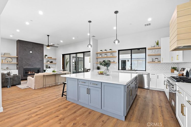 Fireplace, Interior, Kitchen, Living room, Pendant Lights, Recessed Lighting, Stainless Steel Appliances, Wood Texture Flooring