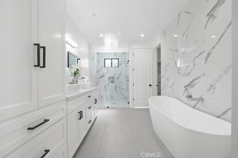 Bathroom, Dual Sink Vanities, Free Standing Baths, Glass Shower, Interior, Marble Walls, Recessed Lighting