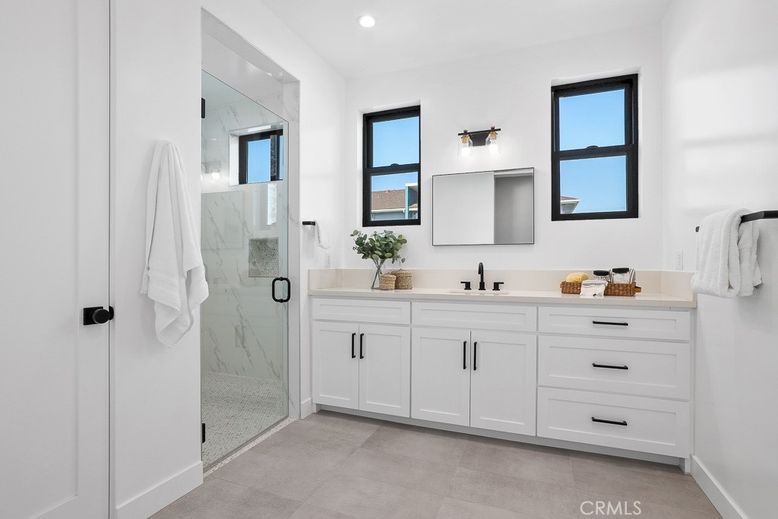 Bathroom, Dual Sink Vanities, Glass Shower, Interior, Marble Walls, Recessed Lighting