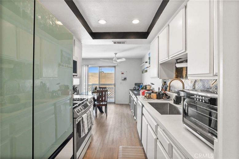 Dining room, Interior, Kitchen, Recessed Lighting, Stainless Steel Appliances, Wood Texture Flooring