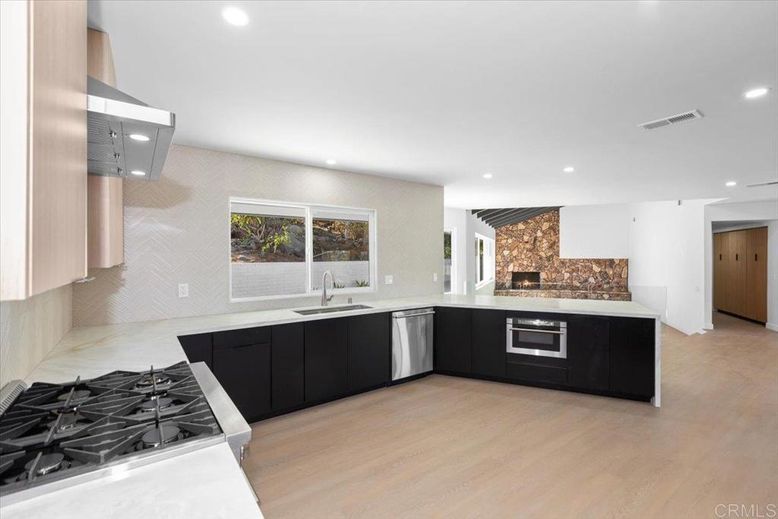 Fireplace, Interior, Kitchen, Recessed Lighting, Stainless Steel Appliances, Wood Texture Flooring