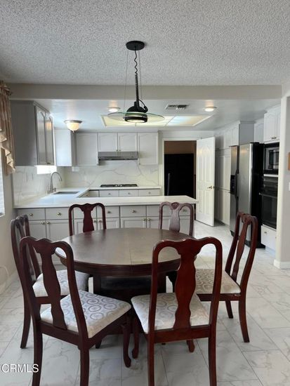 Dining room, Interior, Kitchen, Marble, Marble Walls, Pendant Lights, Stainless Steel Appliances