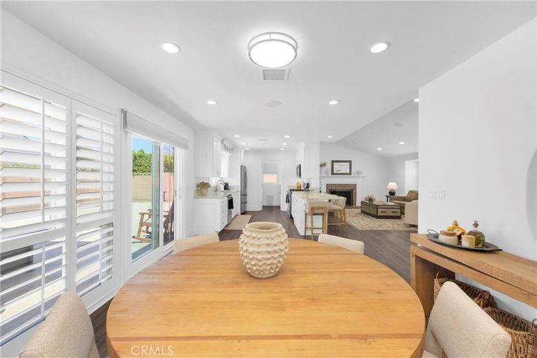Dining room, Fireplace, Interior, Living room, Recessed Lighting, Wood Texture Flooring