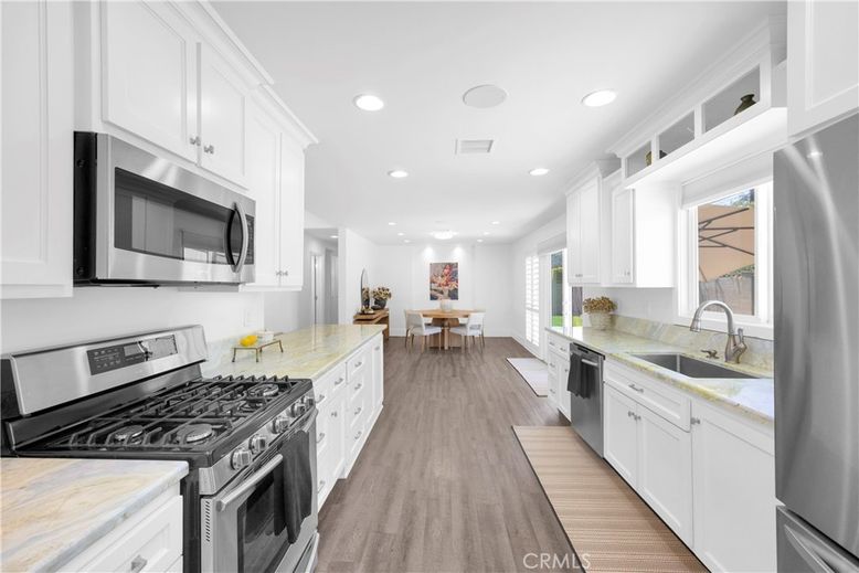 Dining room, Interior, Kitchen, Recessed Lighting, Stainless Steel Appliances, Wood Texture Flooring