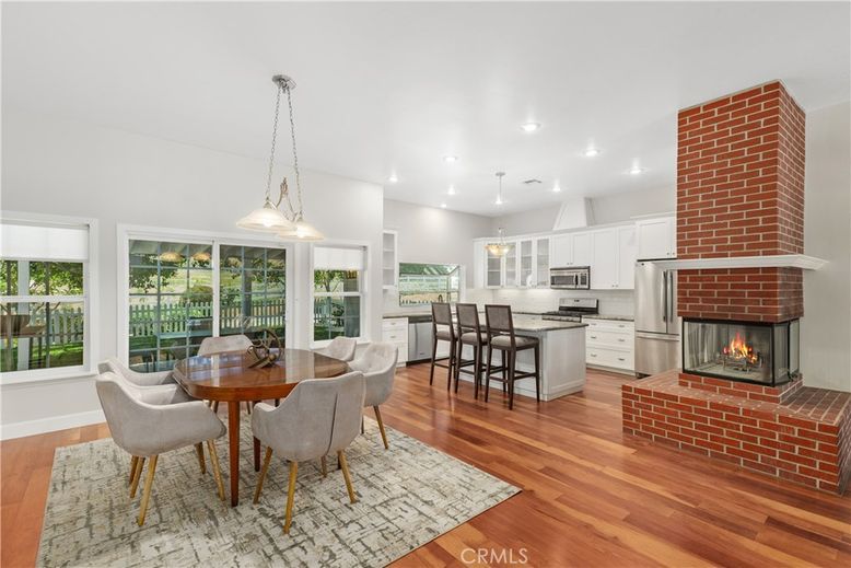 Dining room, Fireplace, Interior, Kitchen, Pendant Lights, Recessed Lighting, Stainless Steel Appliances, Wood Texture Flooring