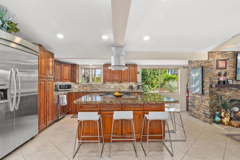 Fireplace, Interior, Kitchen, Recessed Lighting, Stainless Steel Appliances, Stone Walls