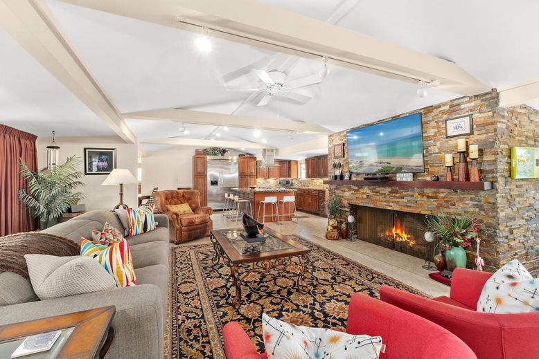 Fireplace, Interior, Kitchen, Living room, Recessed Lighting, Stainless Steel Appliances, Stone Walls