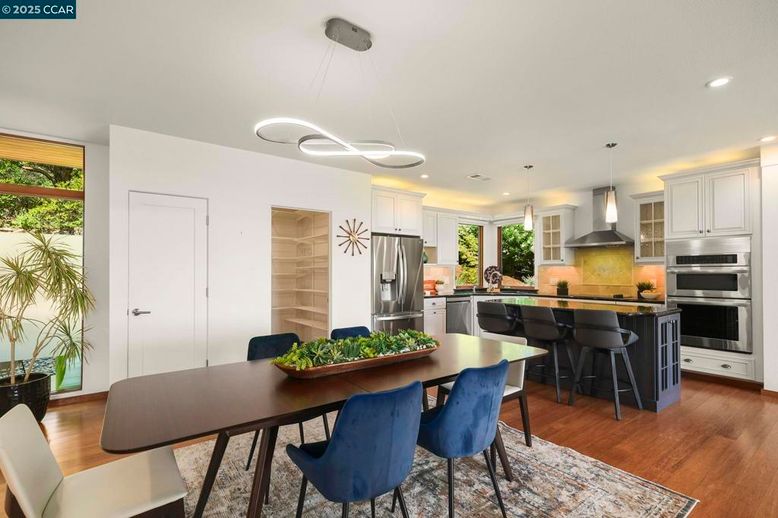 Dining room, Interior, Kitchen, Pendant Lights, Recessed Lighting, Stainless Steel Appliances, Wood Texture Flooring