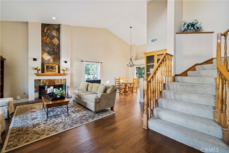 Chandelier, Dining room, Fireplace, Interior, Living room, Pendant Lights, Recessed Lighting, Wood Texture Flooring