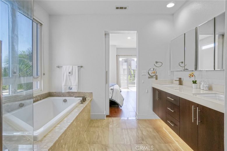 Bathroom, Dual Sink Vanities, Glass Shower, Interior, Recessed Lighting, Wood Texture Flooring