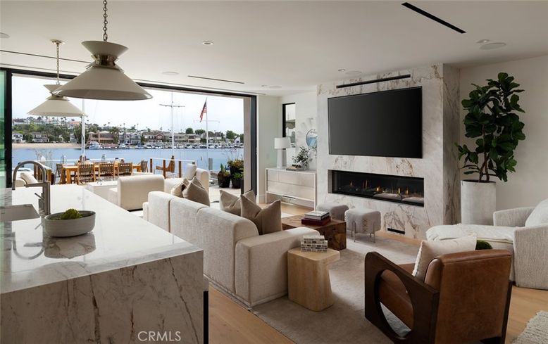 Dining room, Fireplace, Interior, Living room, Pendant Lights, Recessed Lighting, Water, Wood Texture Flooring