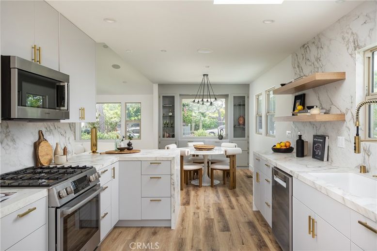 Dining room, Interior, Kitchen, Marble Walls, Pendant Lights, Recessed Lighting, Stainless Steel Appliances, Wood Texture Flooring