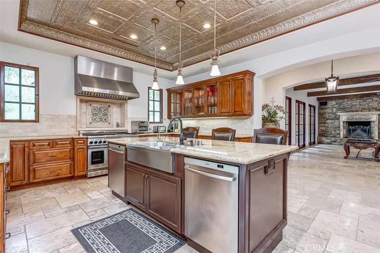Fireplace, Interior, Kitchen, Pendant Lights, Recessed Lighting, Stainless Steel Appliances, Stone Walls