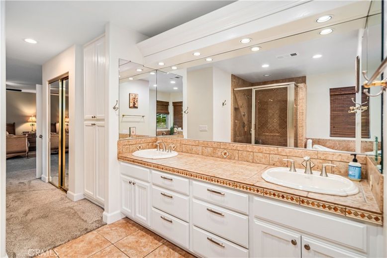 Bathroom, Dual Sink Vanities, Interior, Recessed Lighting, Tile Countertops