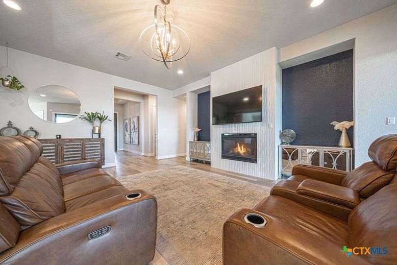 Home Theatre Room, Fireplace, Interior, Living room, Pendant Lights, Recessed Lighting, Wood Texture Flooring