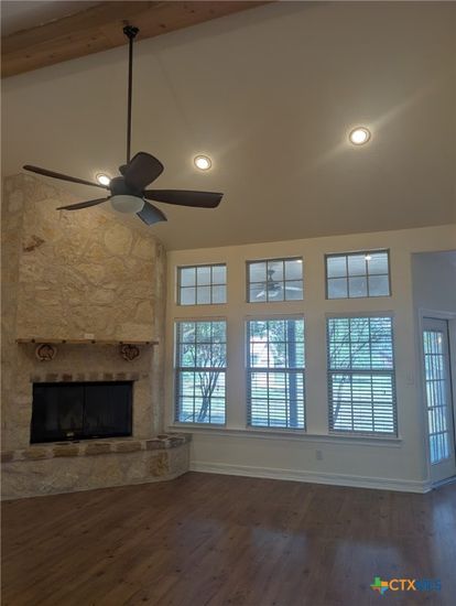 Empty room, Fireplace, Interior, Recessed Lighting, Stone Walls, Wooden Beams, Wood Texture Flooring