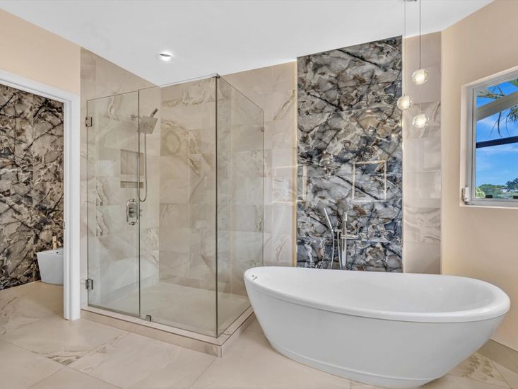 Bathroom, Free Standing Baths, Glass Shower, Interior, Marble, Marble Walls, Pendant Lights, Recessed Lighting