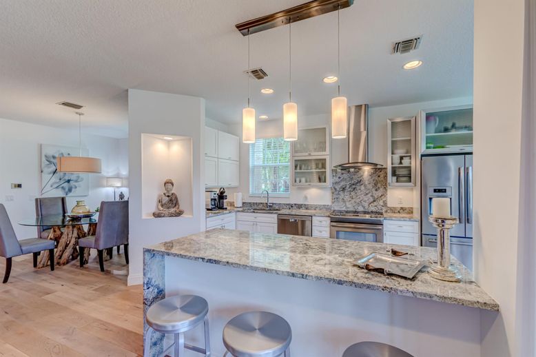 Dining room, Interior, Kitchen, Pendant Lights, Recessed Lighting, Stainless Steel Appliances, Wood Texture Flooring